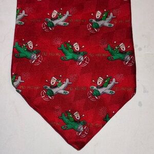 HOLIDAY TRADITIONS RED SILK TIE WITH SANTA ON AN AIRPLANE DESIGN